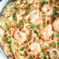Black pan with assorted seafood and jumbo prawns cream sauce fettuccine.