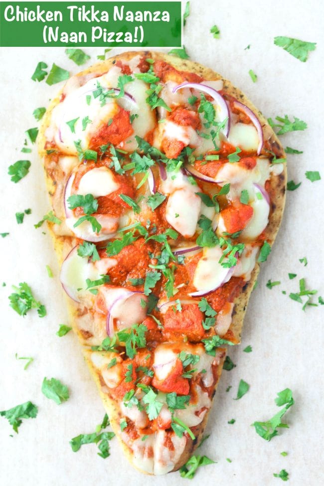 Naan pizza with spicy pizza sauce, chicken tikka pieces, red onion, cheese, and chopped coriander