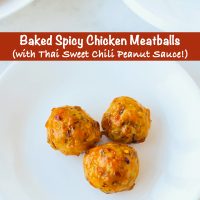 Three chicken meatballs on a plate coated in sweet chili peanut sauce.