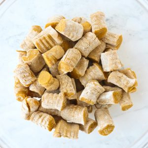 Sweet Potato Gnocchi pieces in a glass mixing bowl.