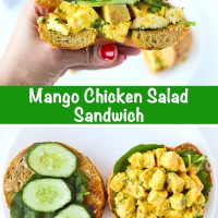 Hand holding up half of a mango chicken salad bagel sandwich. 10 cereal bagel halves with mixed green leaves, cucumber slices, and mango chicken salad on a white plate.