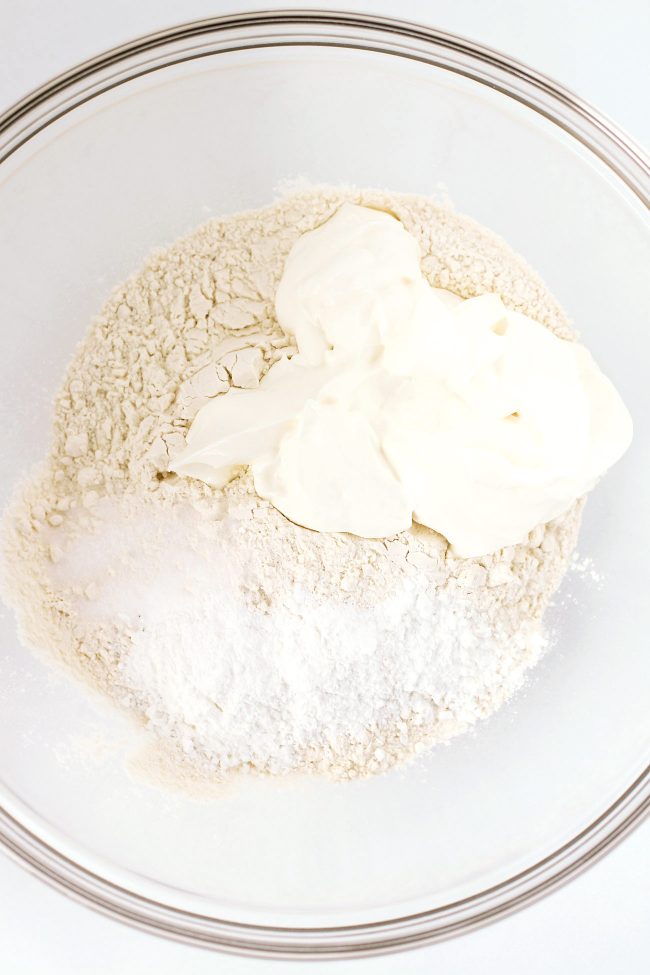 Flour, Greek yogurt, baking powder, and sea salt in a large mixing bowl.