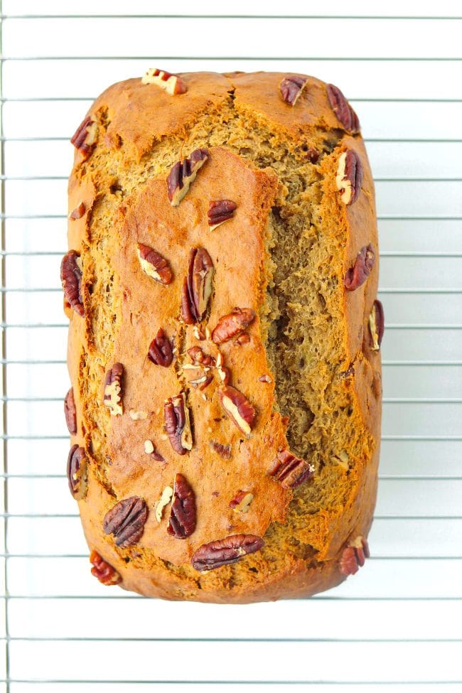 Baked banana pecan nut bread on top of cooling rack.
