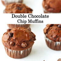 Muffins lined up on parchment paper and chocolate chips scattered in the front. Text overlay "Double Chocolate Chip Muffins*.