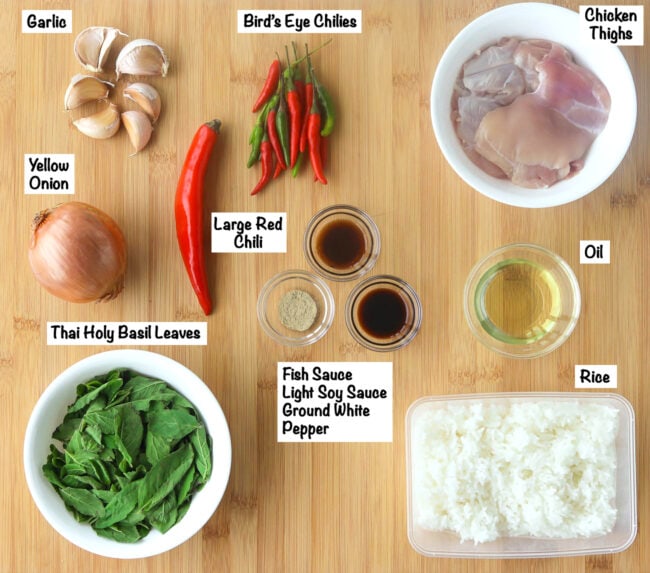 Labeled ingredients for Spicy Thai Basil Chicken Fried Rice on wooden board.