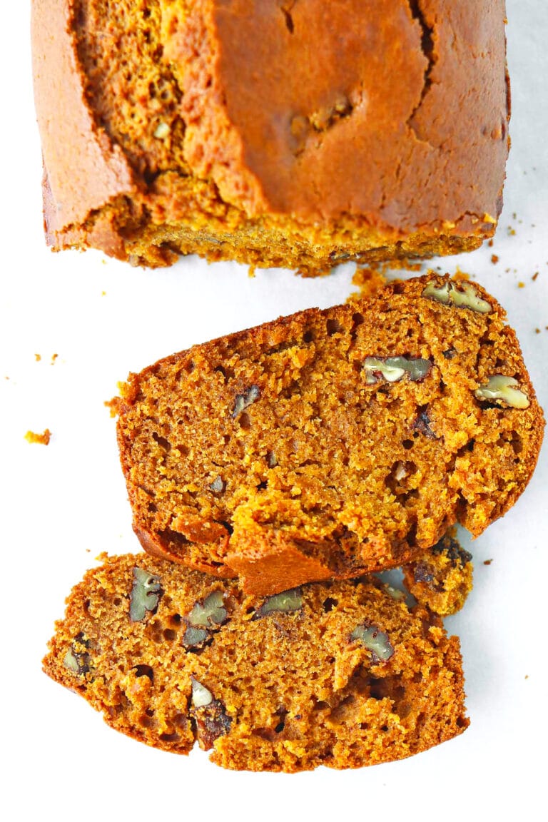 Pumpkin pecan bread loaf and slices top view.