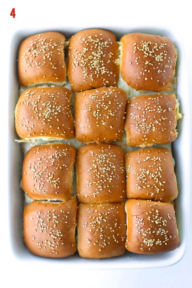 Top view of baked sliders in a large baking dish.