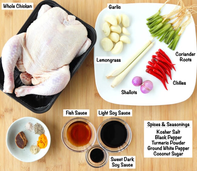Labeled ingredients for Spicy Thai Roast Chicken on wooden board.