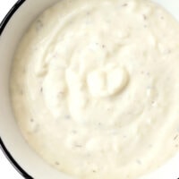Top view of bowl with garlic sauce. Text overlay "Kebab Garlic Sauce" "Just Like Takeaway!", and "thatspicychick.com".