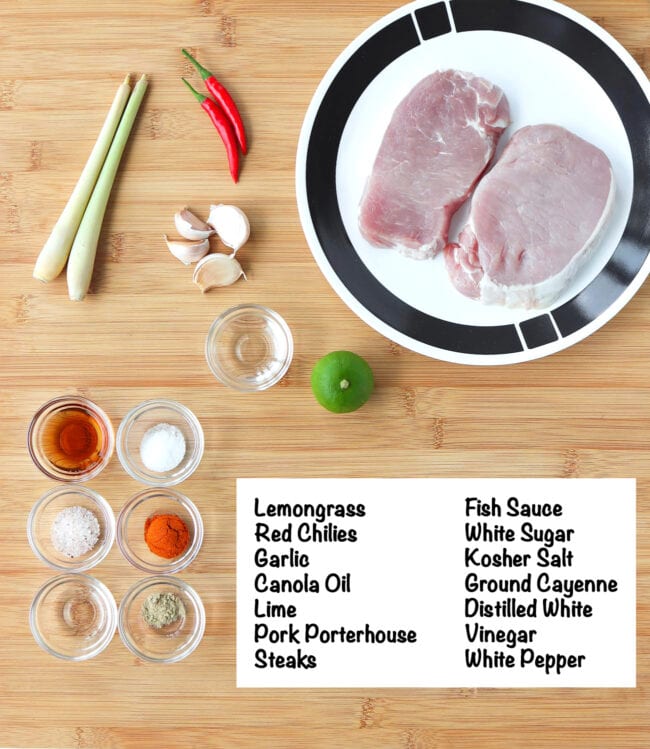 Labeled Ingredients for Vietnamese Grilled Pork Steaks on wooden board.