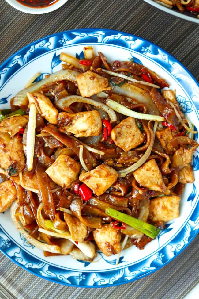 Top view of chicken chow fun on a plate.