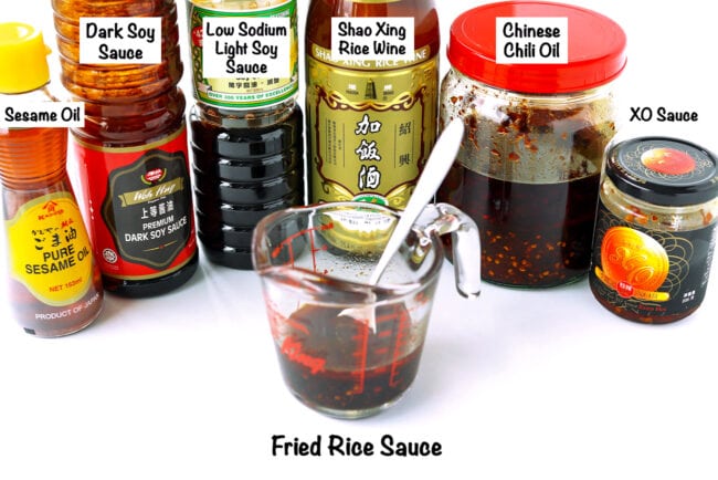 XO Sauce fried rice stir-fry sauce ingredient bottles, and a measuring cup with the sauce.