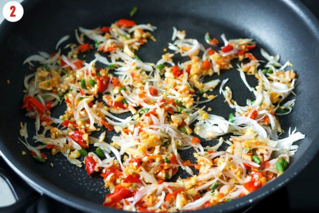 Sautéed garlic, chilies, and shallots in a nonstick skillet.