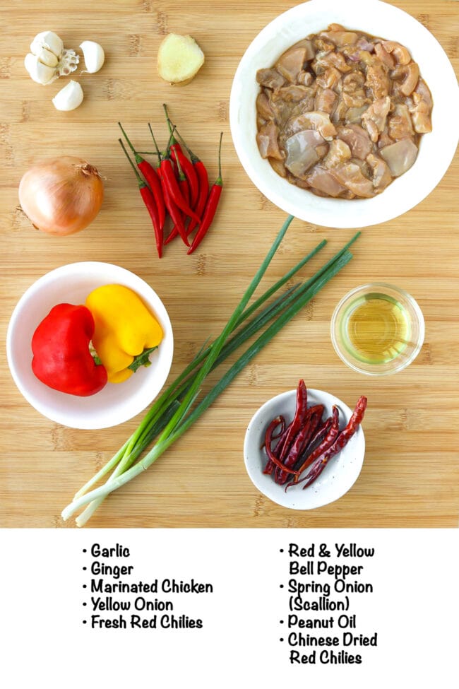 Labeled ingredients for Chicken with Spicy Black Bean Sauce on a wooden board.