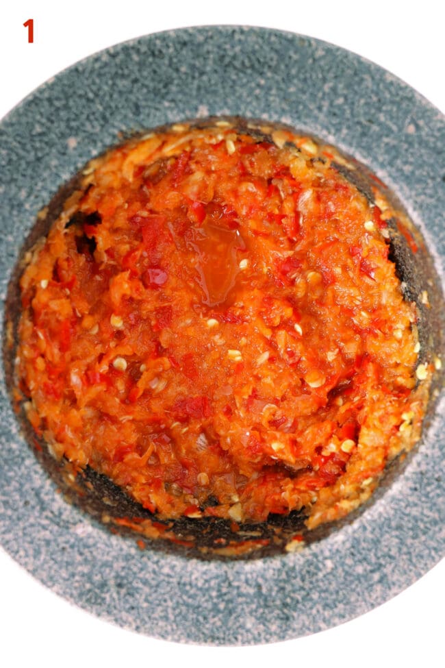 Smashed garlic, ginger, and red chilies paste in a mortar.