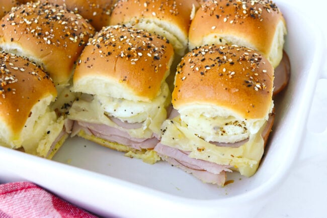 Front view of breakfast sliders in a baking dish.