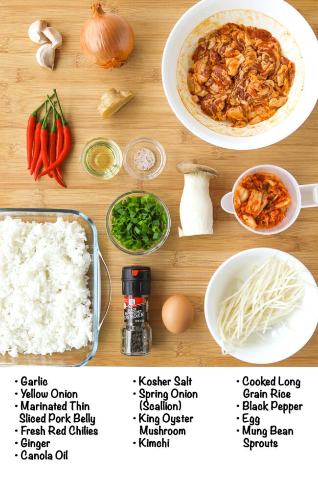 Labeled fresh and pantry ingredients for Kimchi Fried Rice with Pork Belly on a wooden board.