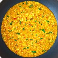 Scrambled cottage cheese dish in a wok. Text overlay "Paneer Bhurji Gravy", "Easy | Vegetarian | Gluten-free", and "thatspicychick.com".