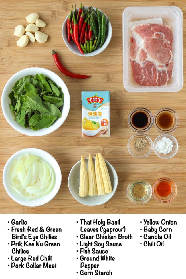 Labeled ingredients for Thai Basil Pork Stir-fry on a wooden board.