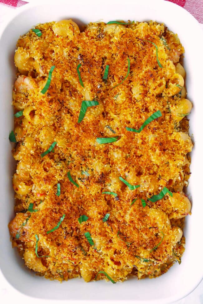 Top view of mac and cheese with crunchy breadcrumbs topping in dish.