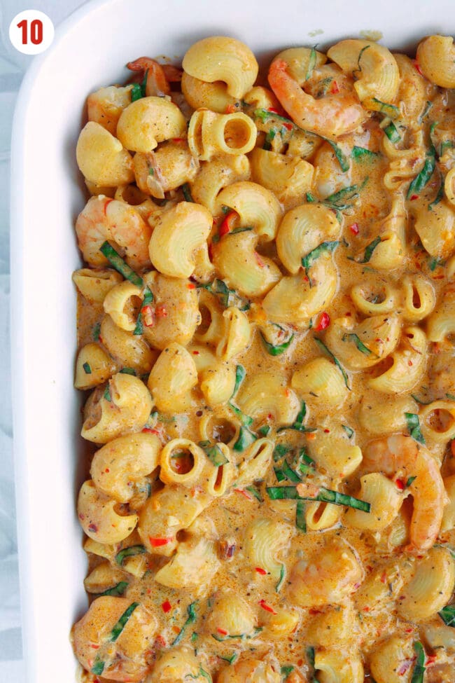 Mac and cheese with shrimp in ovenproof dish.