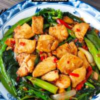 Front view of plate with chicken stir-fry and bowls with rice. Text overlay "XO Sauce Chicken & Chinese Broccoli Stir-fry" and "thatspicychick.com".
