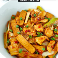 Chicken and tofu stir-fry in a bowl and two rice bowls behind. Text overlay "Hoisin Chicken Stir-fry with Tofu" and "thatspicychick.com".
