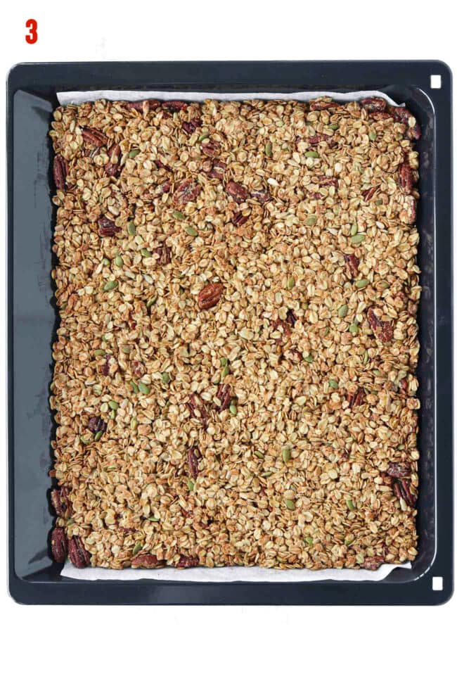 Baked granola on baking tray.