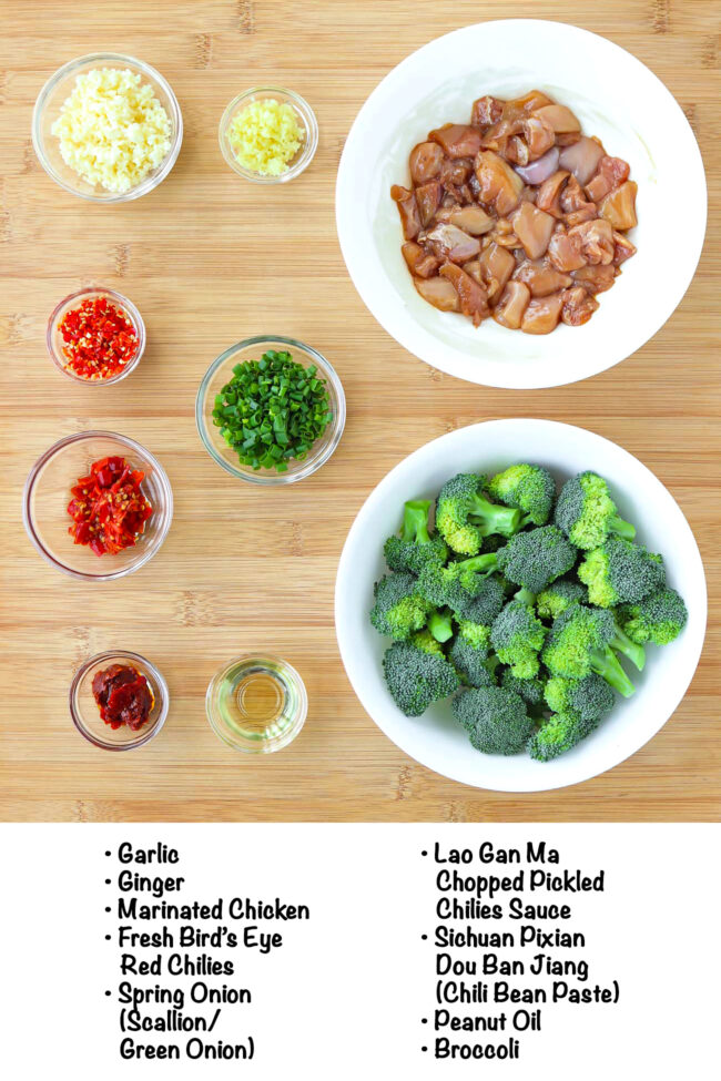 Labeled ingredients for Chili Garlic Chicken and Broccoli Stir-fry on a wooden board.