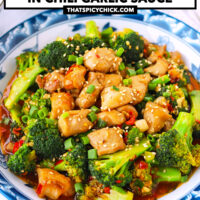 Chicken and broccoli dish on a serving plate and rice bowls behind. Text overlay "Chicken & Broccoli in Chili Garlic Sauce" and "thatspicychick.com".