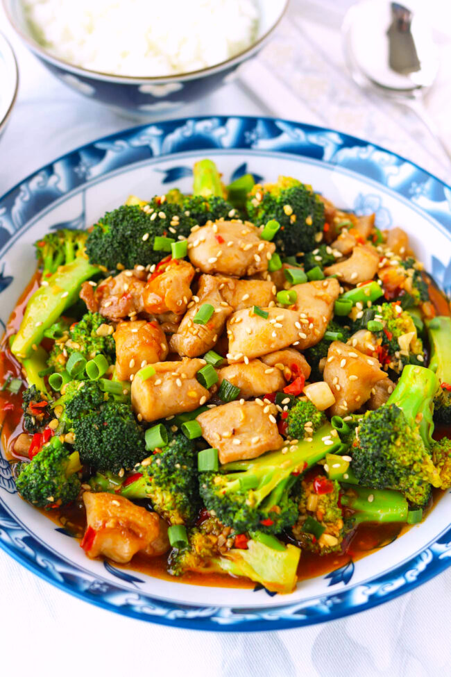 Front view of plate with chicken and broccoli stir-fry and rice bowls.