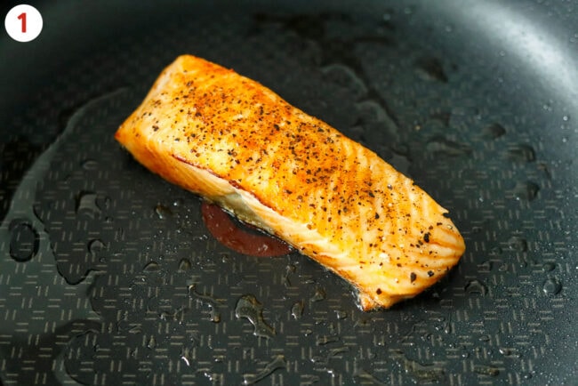 Pan-fried salmon fillet in a nonstick skillet.