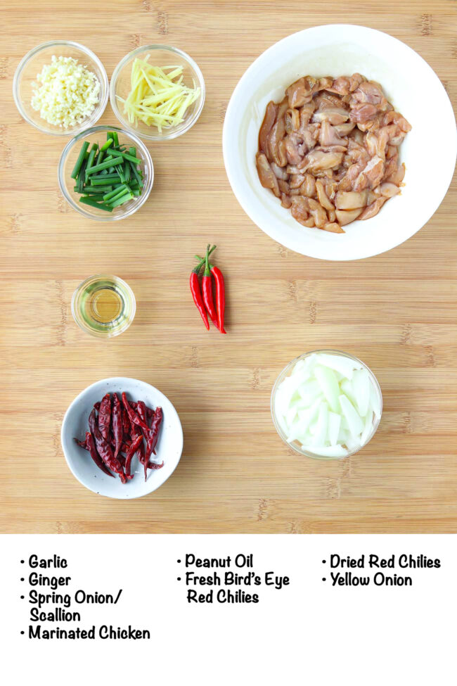 Labeled ingredients for 5-spice chicken stir-fry on a wooden board.