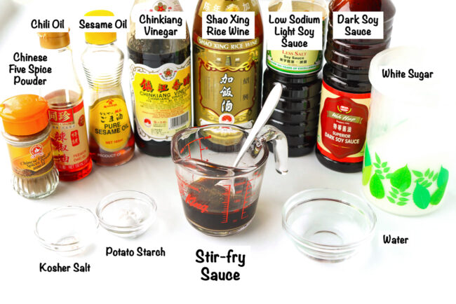 Labeled sauce ingredients for 5-spice chicken stir-fry and sauce in a measuring cup.