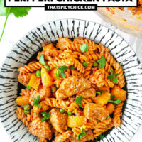 Plate and bowl with peri peri pasta and chicken. Text overlay "High Protein Creamy Peri Peri Chicken Pasta" and "thatspicychick.com".