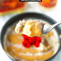 Spoon holding up a bite of overnight oats. Text overlay "Salted Caramel Raspberry Overnight Oats" and "thatspicychick.com".
