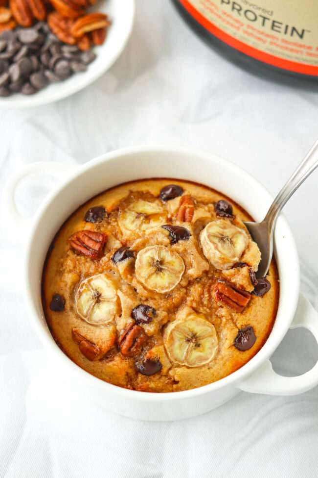 Spoon in bowl with banana bread baked oatmeal.