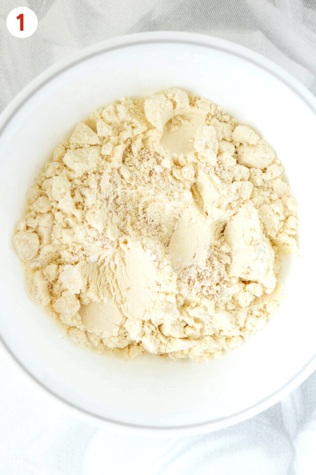 Blended oats, protein powder and baking powder in a bowl.