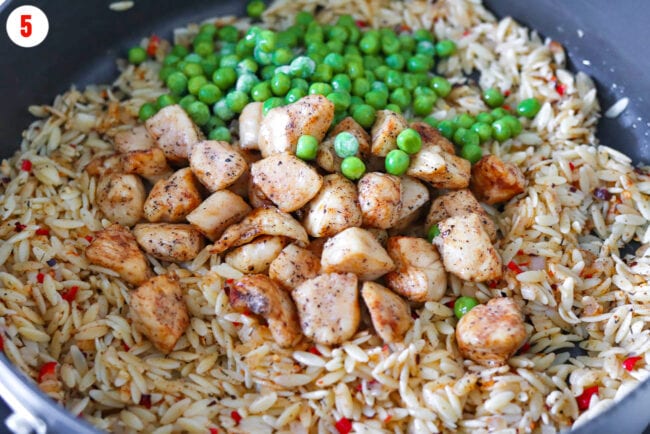Added chicken and green peas to pan with orzo and aromatics.