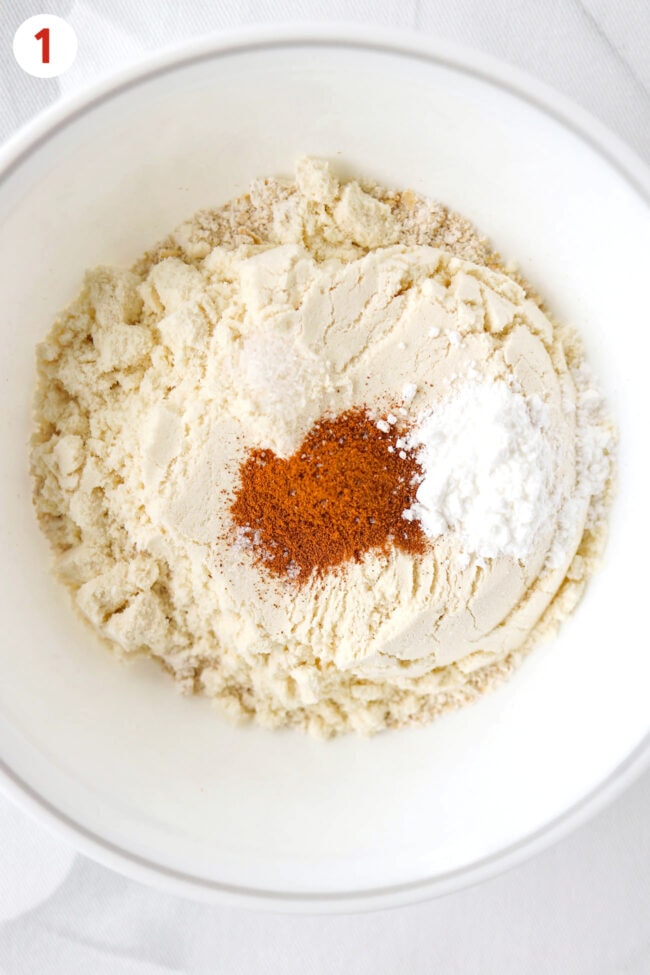Dry ingredients for baked oats in a bowl.