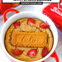 Front view baked oats in a red ramekin. Text overlay "Biscoff Baked Oats with Strawberries" and "thatspicychick.com".