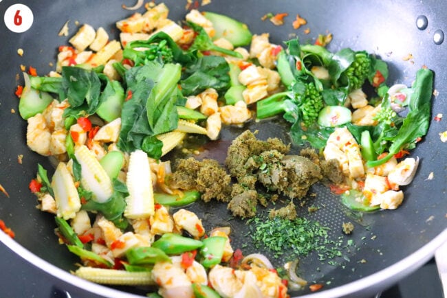 Added Thai green curry paste and minced makrut lime leaves to wok with chicken and veggies.