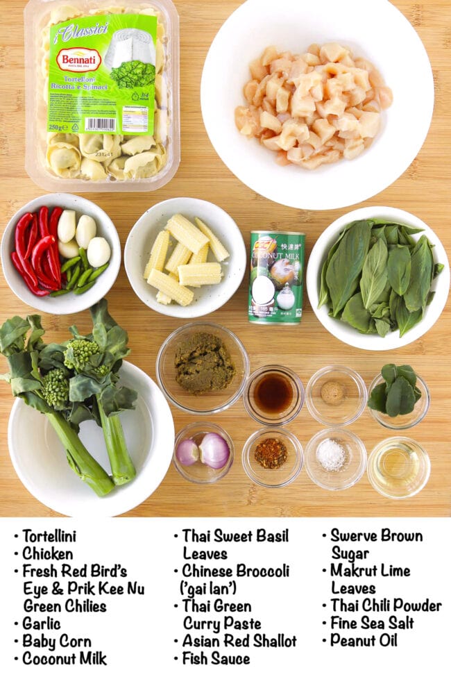 Labeled ingredients for Thai green curry chicken tortellini on a wooden board.