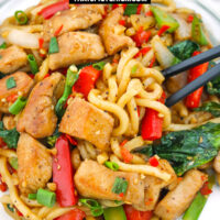 Chopsticks in plate with noodles stir-fry dish. Text overlay "Stir Fried Black Pepper Chicken Noodles" and "thatspicychick.com".
