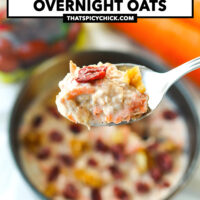 Spoon holding up a bite of overnight oats above a bowl. Text overlay "Gluten Free | High Protein | Easy", "Carrot Cake Overnight Oats" and "thatspicychick.com".