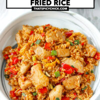 Fried rice on a marble plate and in a wok. Text overlay "Sambal Chicken Fried Rice" and "thatspicychick.com".