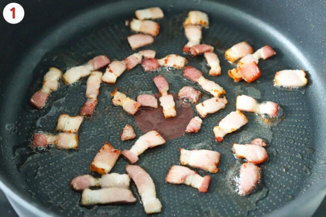 Cooking bacon strips in a skillet.