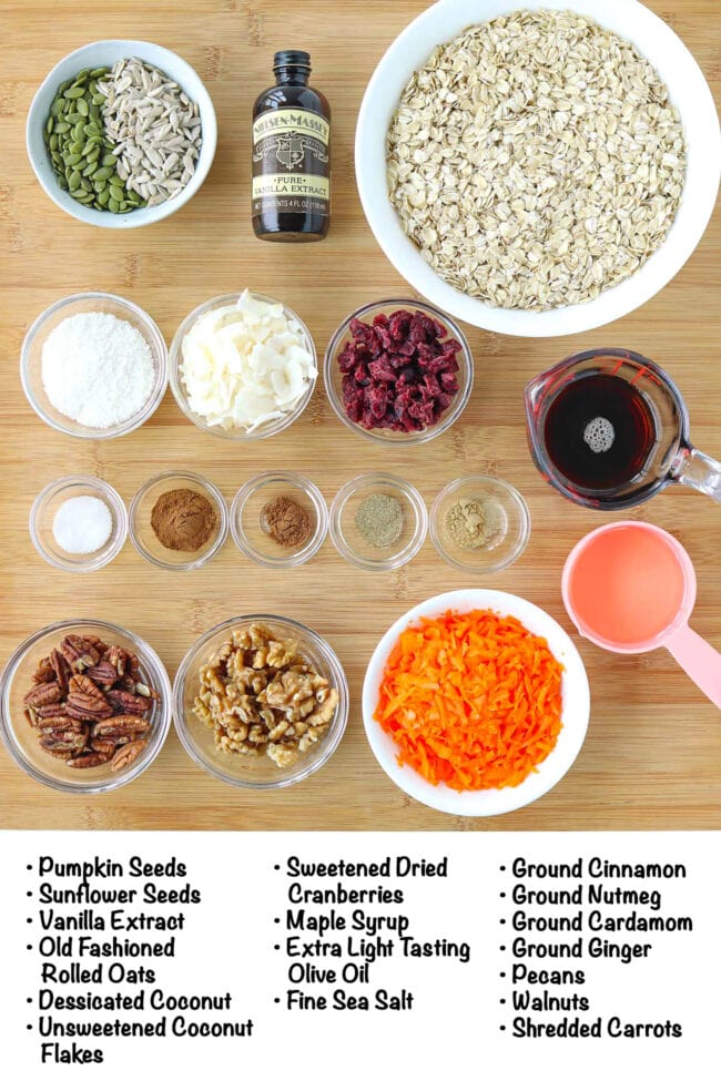 Labeled ingredients for carrot cake granola on a wooden board.
