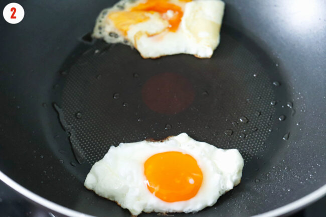 Frying eggs in a wok.