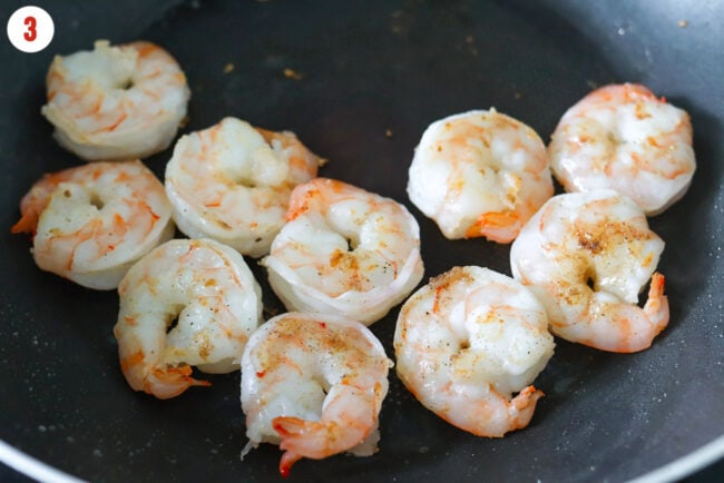 Cooking shrimp in a wok.